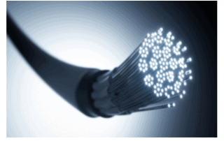 Close-up of a fibre optic cable with glowing fibre strands, representing high-speed internet and data transfer